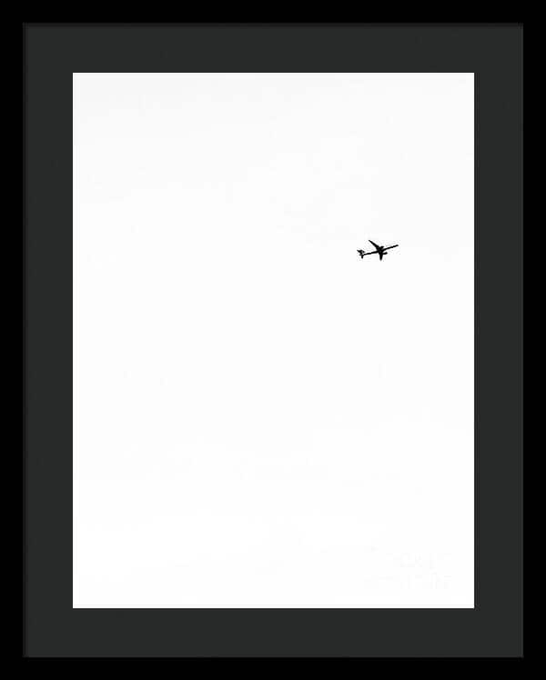 Silhouette of Airplane in Vast Sky Framed Print